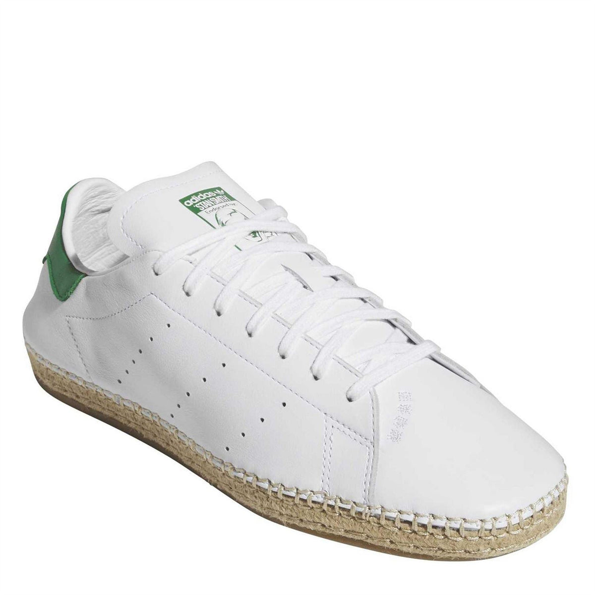 White low-top trainers with green heel detail, lace-up front and textured sole