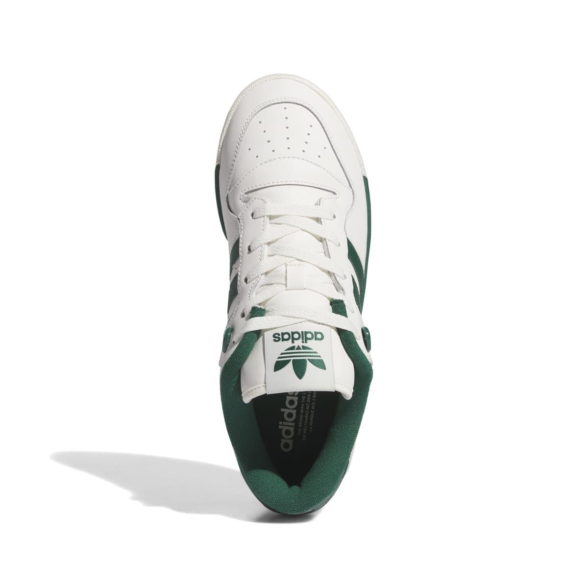 adidas Rivalry Low trainers viewed from the toe: white upper with green heel lining