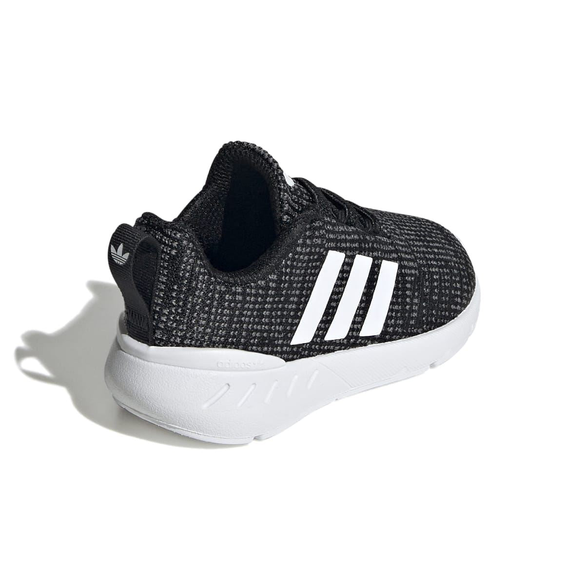 Infant black slip-on style heel area with white three stripes and white midsole