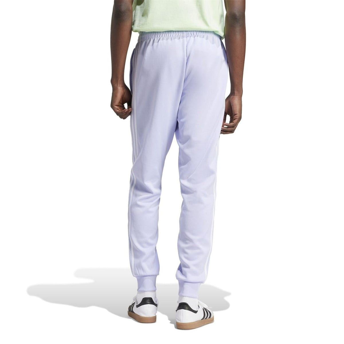Light purple tapered track pants with elastic waistband and ankle ribbed cuffs