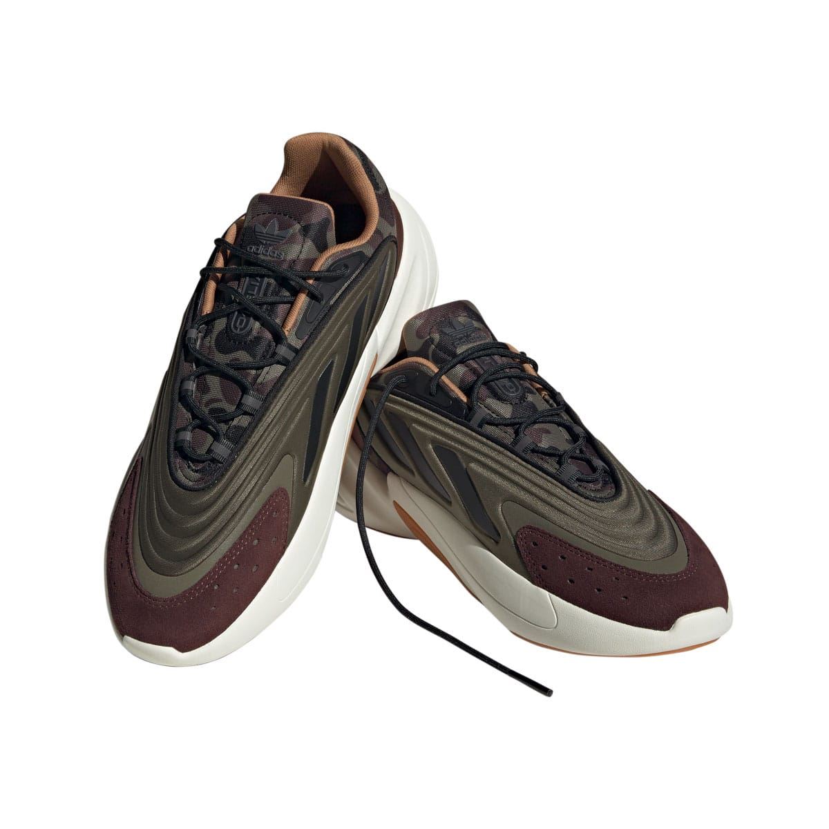 Two low-top trainers in olive and burgundy with black laces and white sole