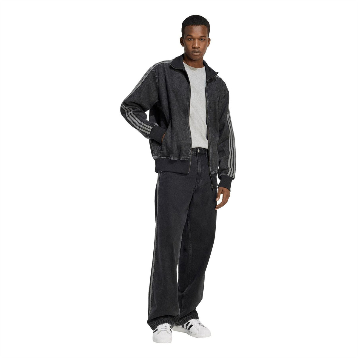 Dark denim athletic top with funnel neck, full zip, and side-sleeve stripe accents
