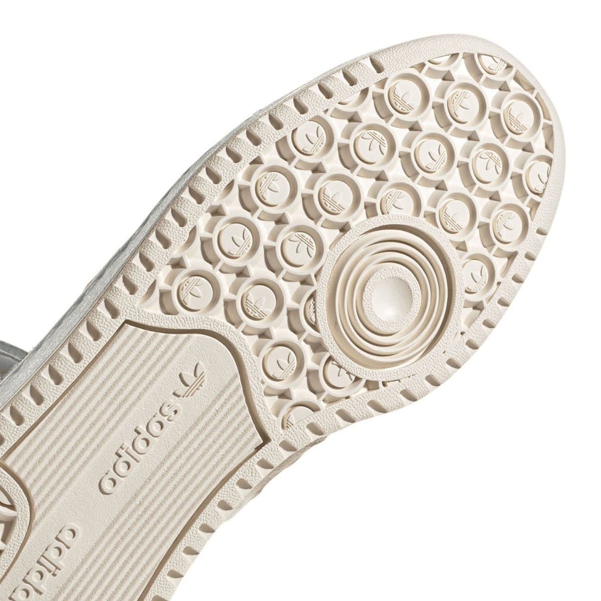 Cream adidas sneaker outsole with circular tread pattern