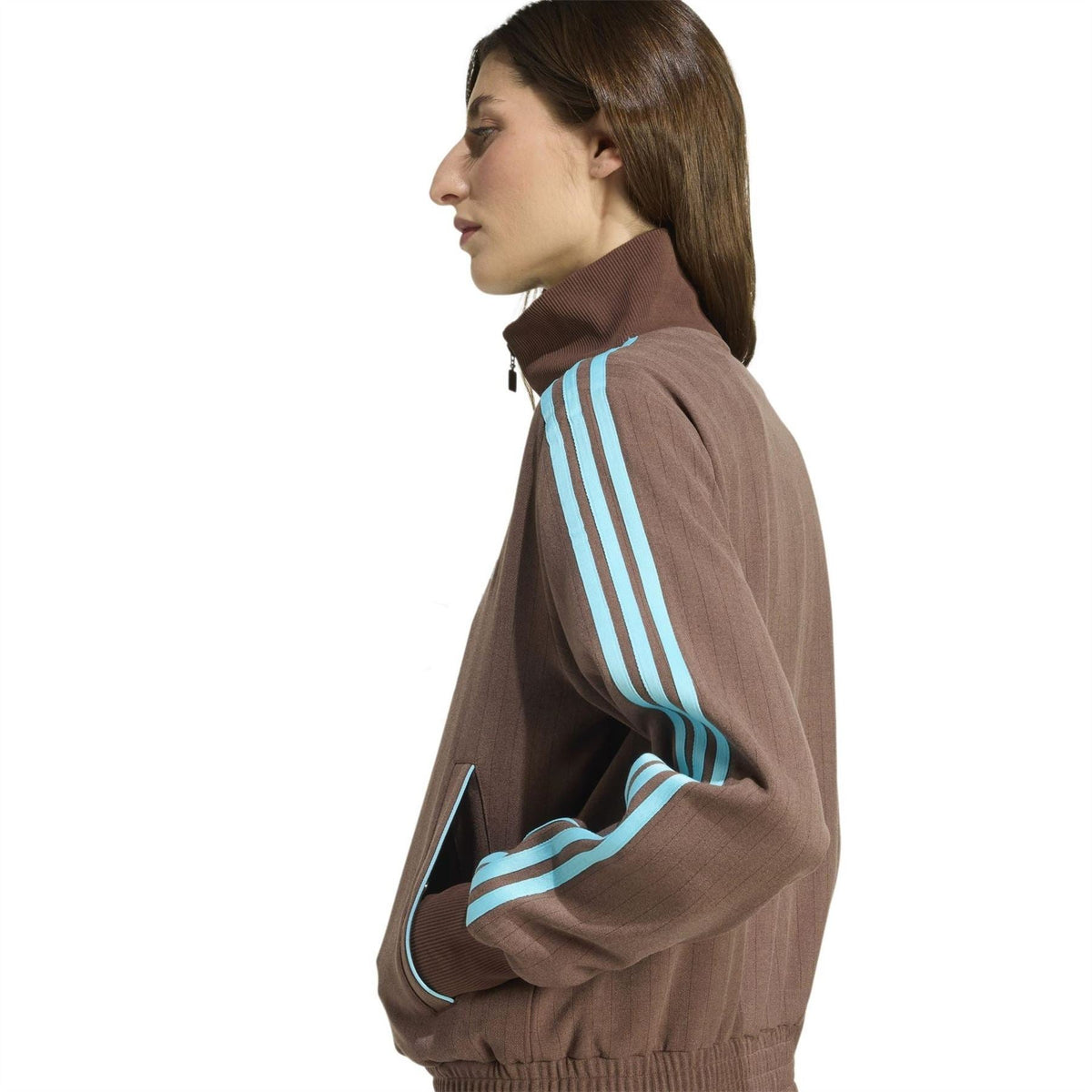 Brown track jacket with turquoise side stripes and ribbed cuffs, full zip closure
