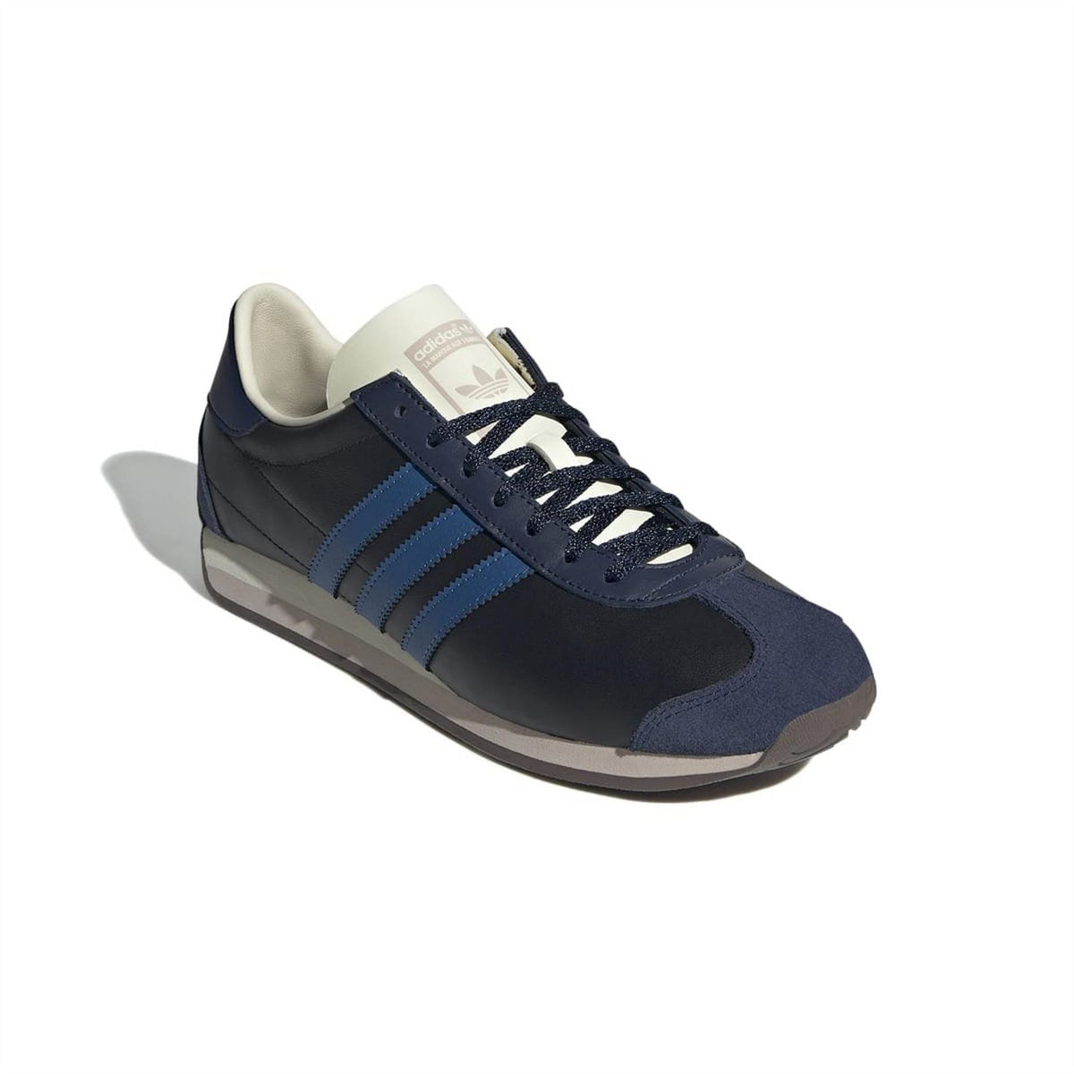 Low-top sneakers in navy and light blue, with lace-up front and cream lining