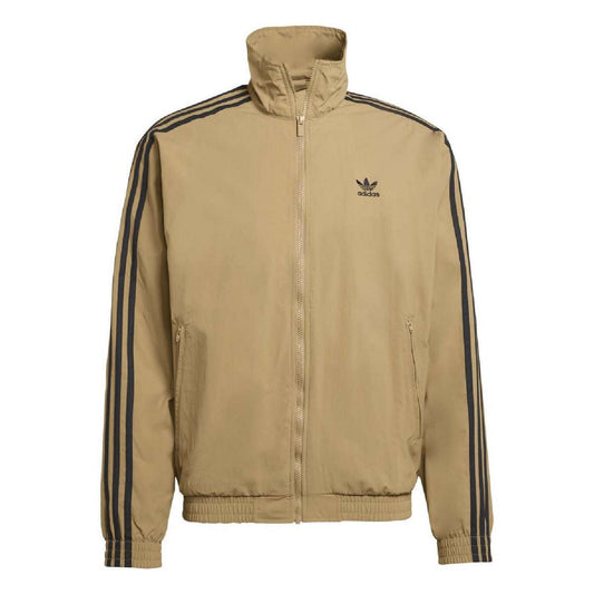 Tan track top with high neck, full zip, long sleeves, and navy side stripes.