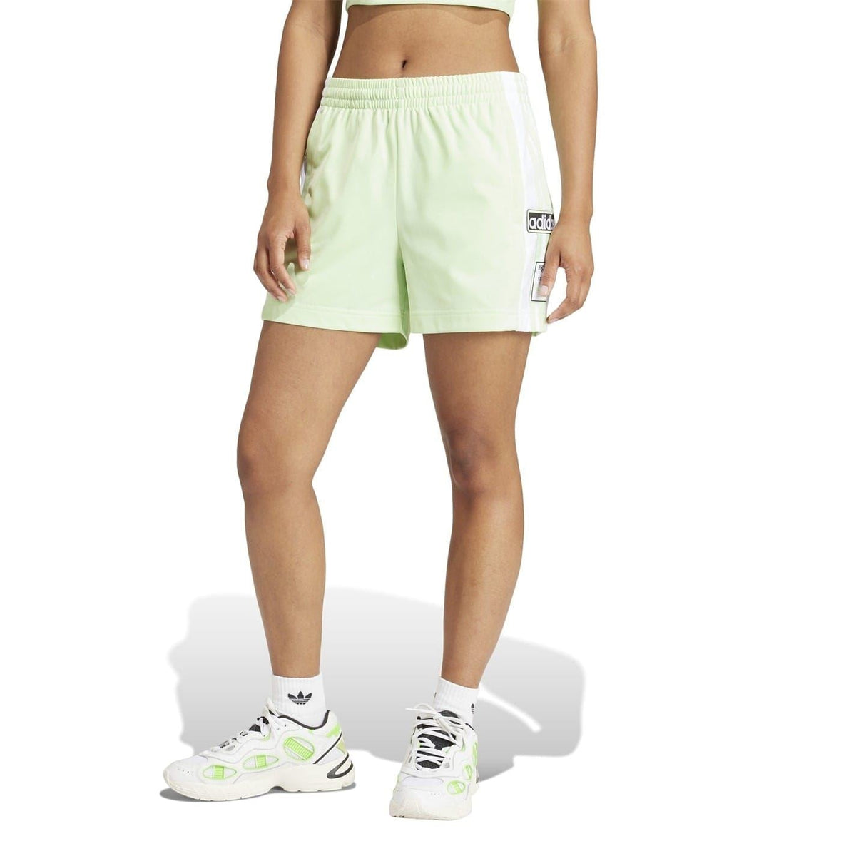 Light green Bermuda shorts with elastic waistband and white side stripe accents