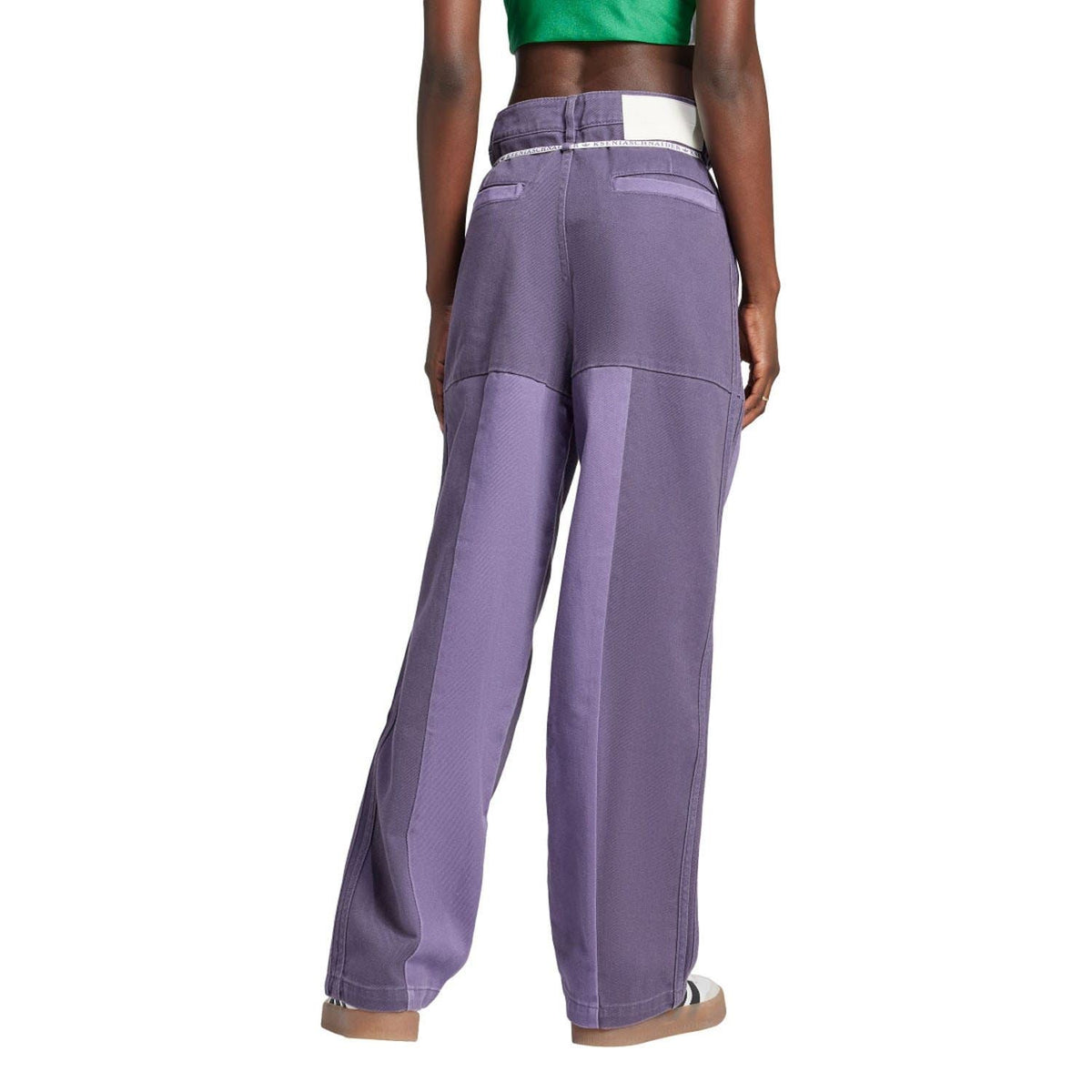 Purple patchwork straight-leg jeans with panel seams and relaxed fit.
