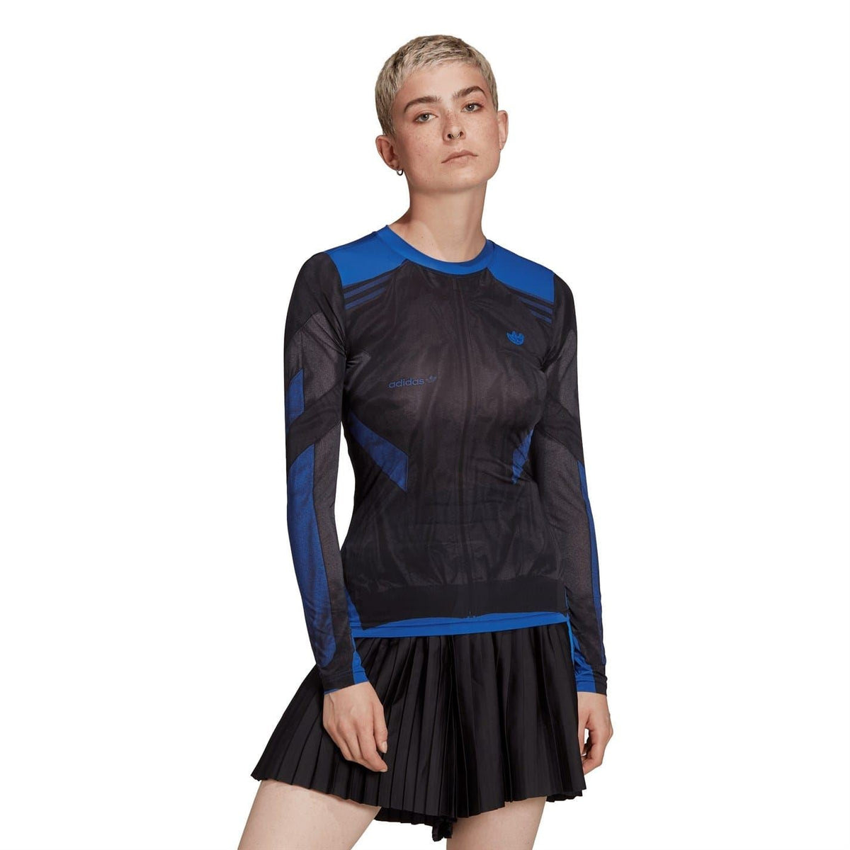 Black long-sleeve crew neck T-shirt with blue accents and logo, worn with pleated skirt