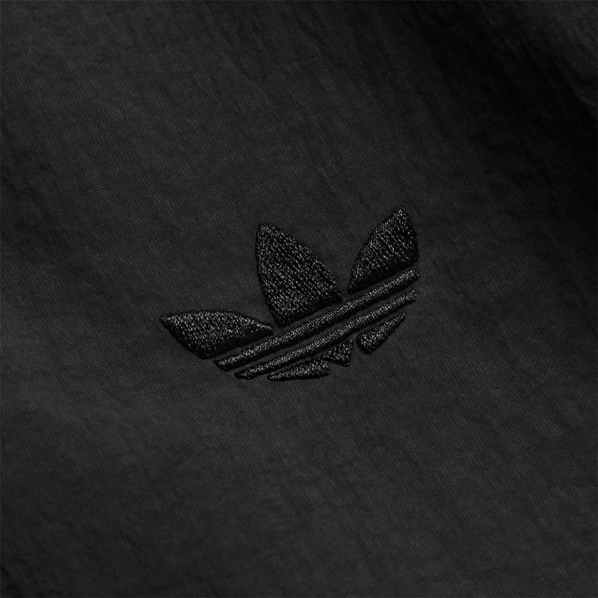 Black adidas trefoil logo embroidered on track jacket chest