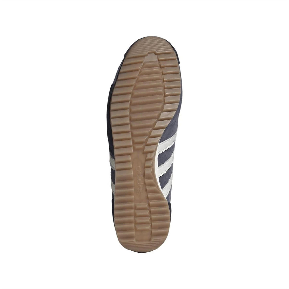Navy sneaker outsole with textured tan gum rubber tread