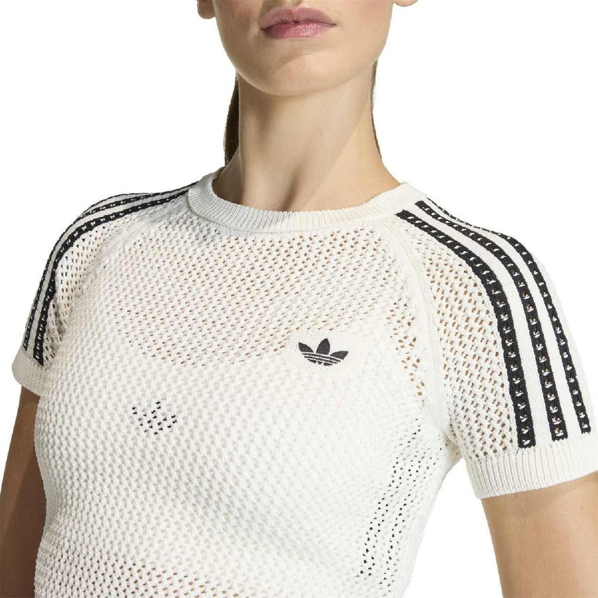 Off-white knitted crochet T-shirt close-up with adidas trefoil logo and black shoulder stripe trim