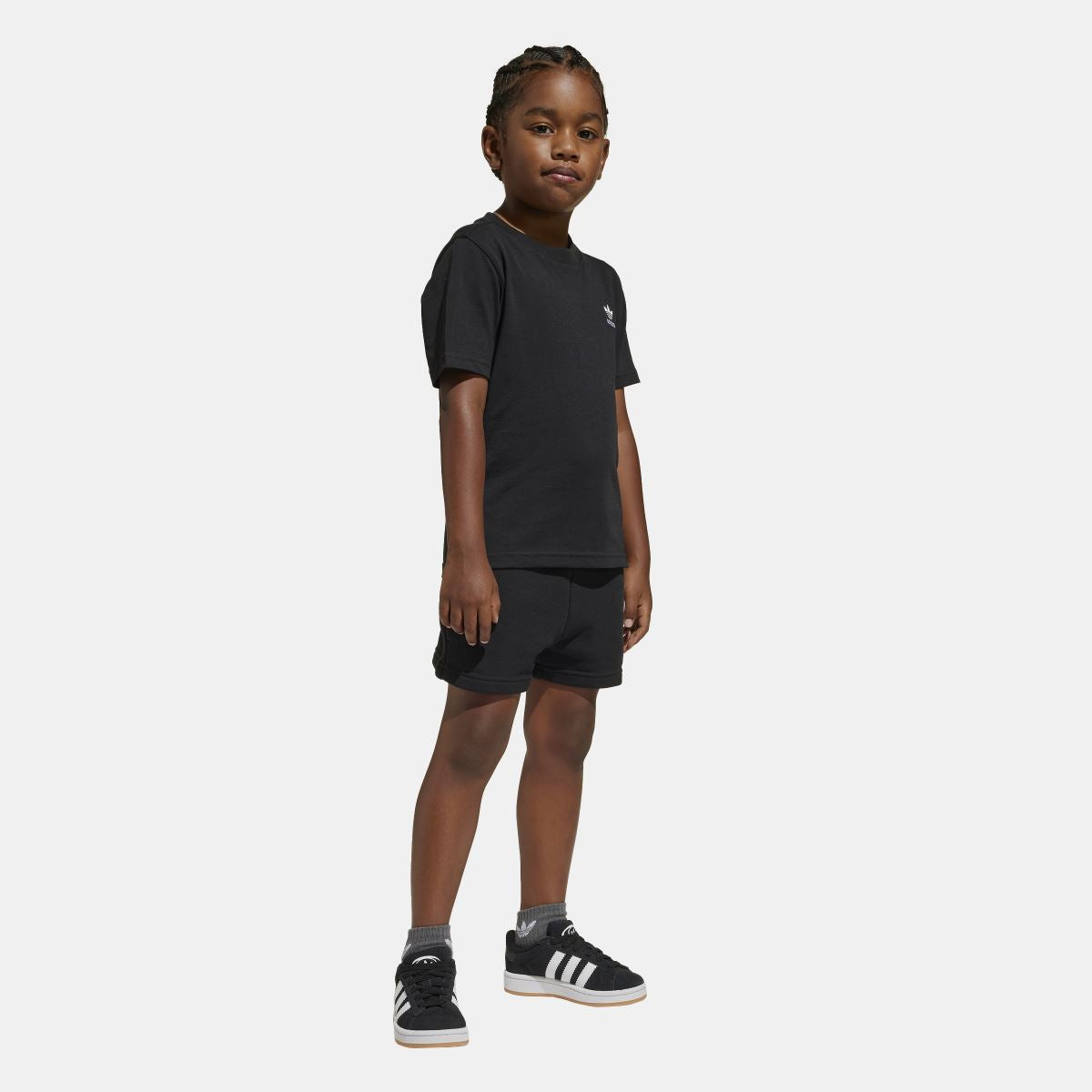 Black juniors T-shirt and shorts set on child, front view