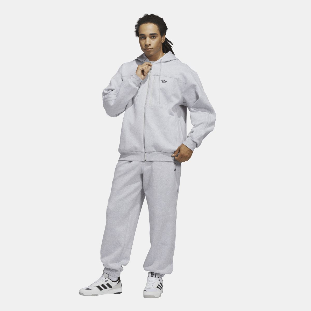 Grey zip fleece hoodie on model, front view with hood up and chest trefoil logo.