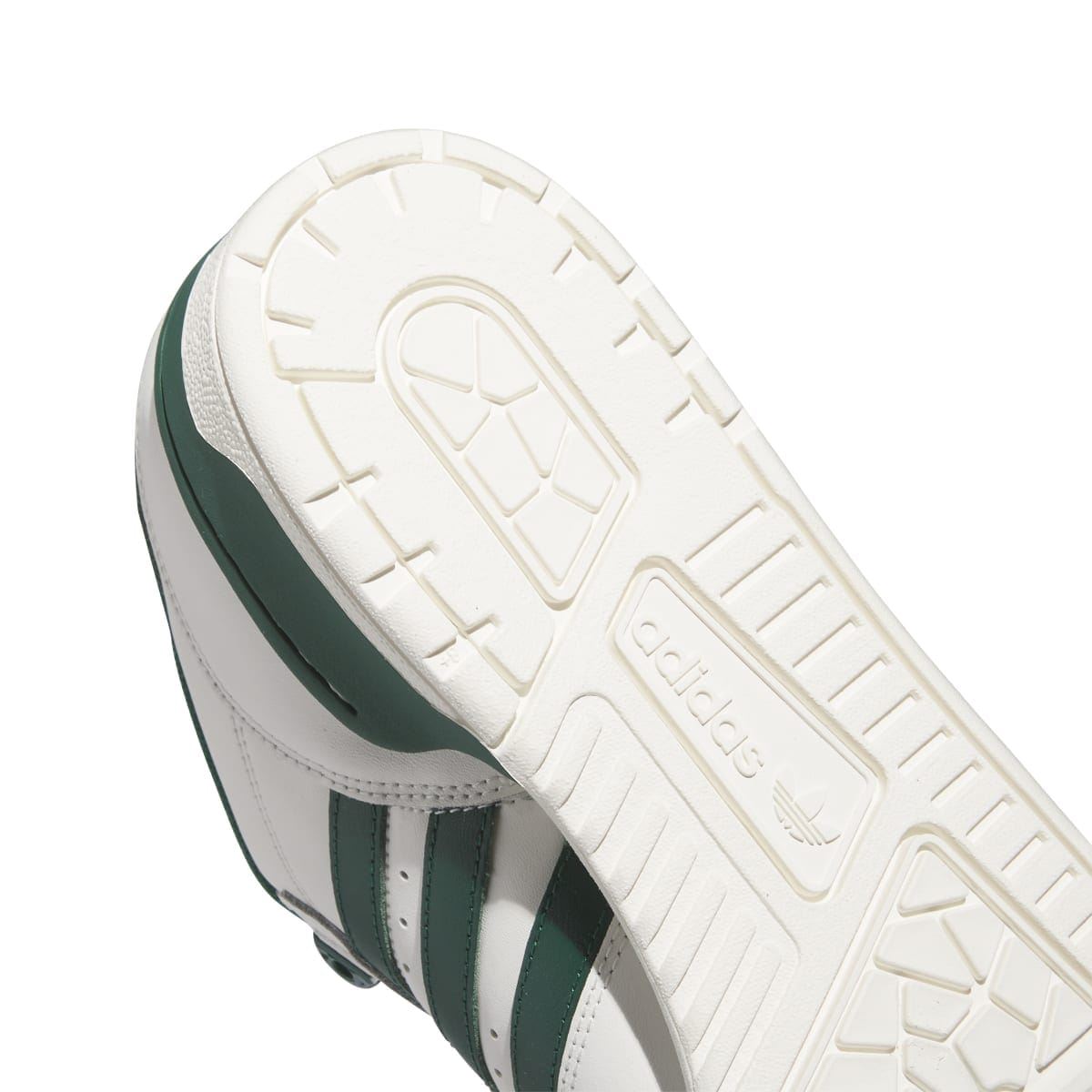 Close-up outsole of adidas Rivalry Low trainers with traction lines and brand marks