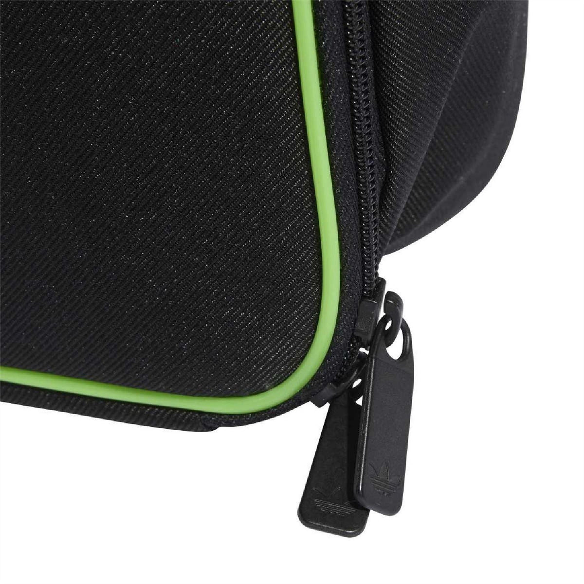 Black adidas Originals lunchbag detail with neon-green trim and zip pull