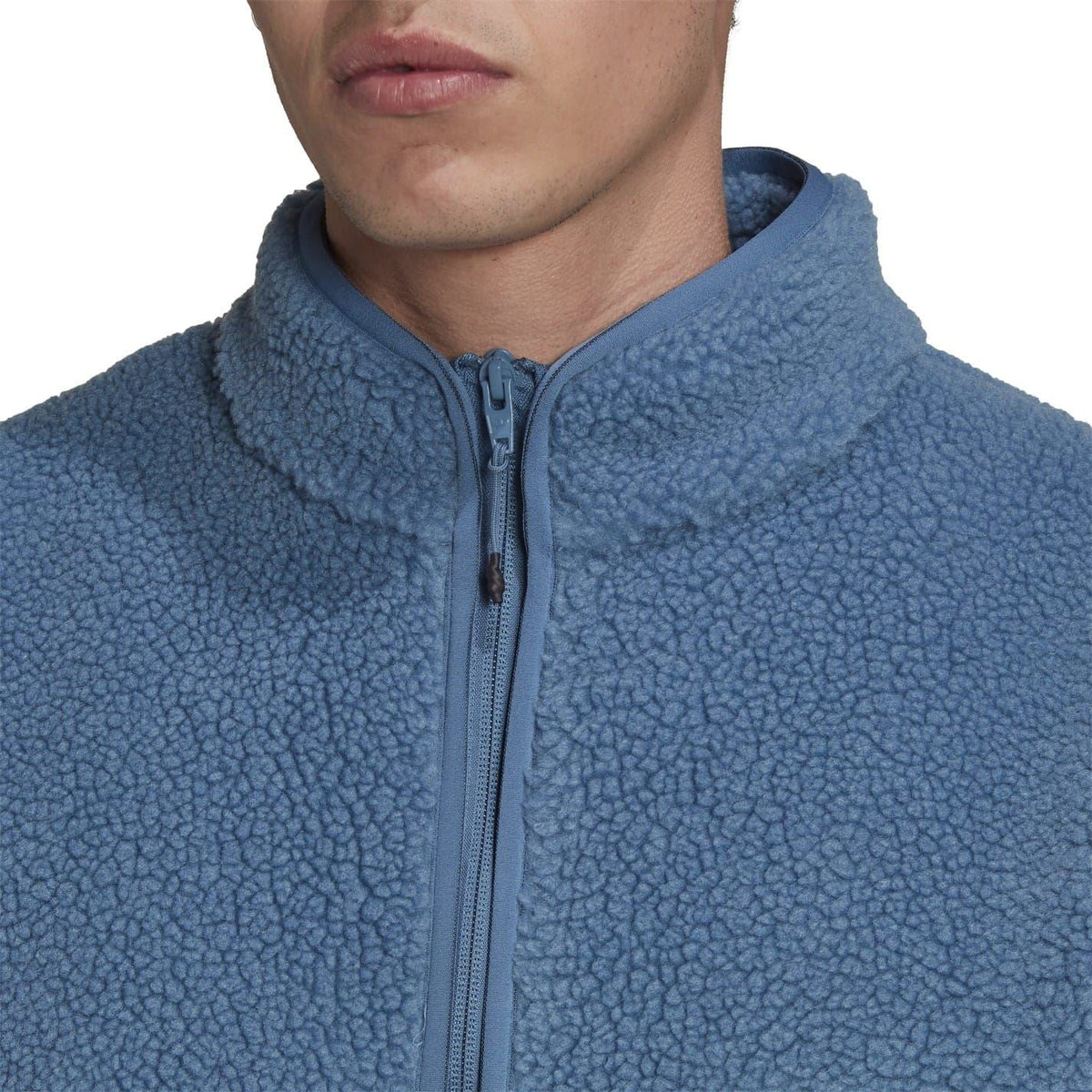 adidas Originals Sherpa Jacket sweatshirt in black with cozy fleece lining, front zipper, and logo detail on chest