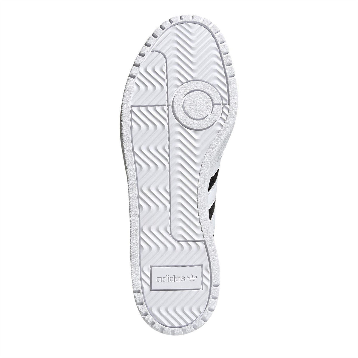 Sneaker outsole underside with patterned tread on a light rubber sole