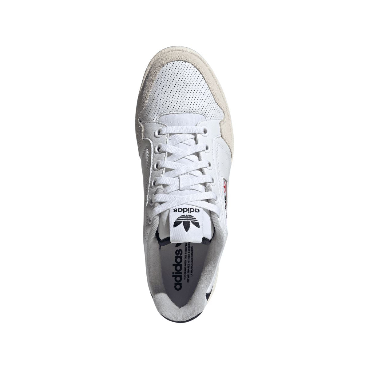 White adidas NY 90 trainer viewed from toe and side, gray interior lining and laces.