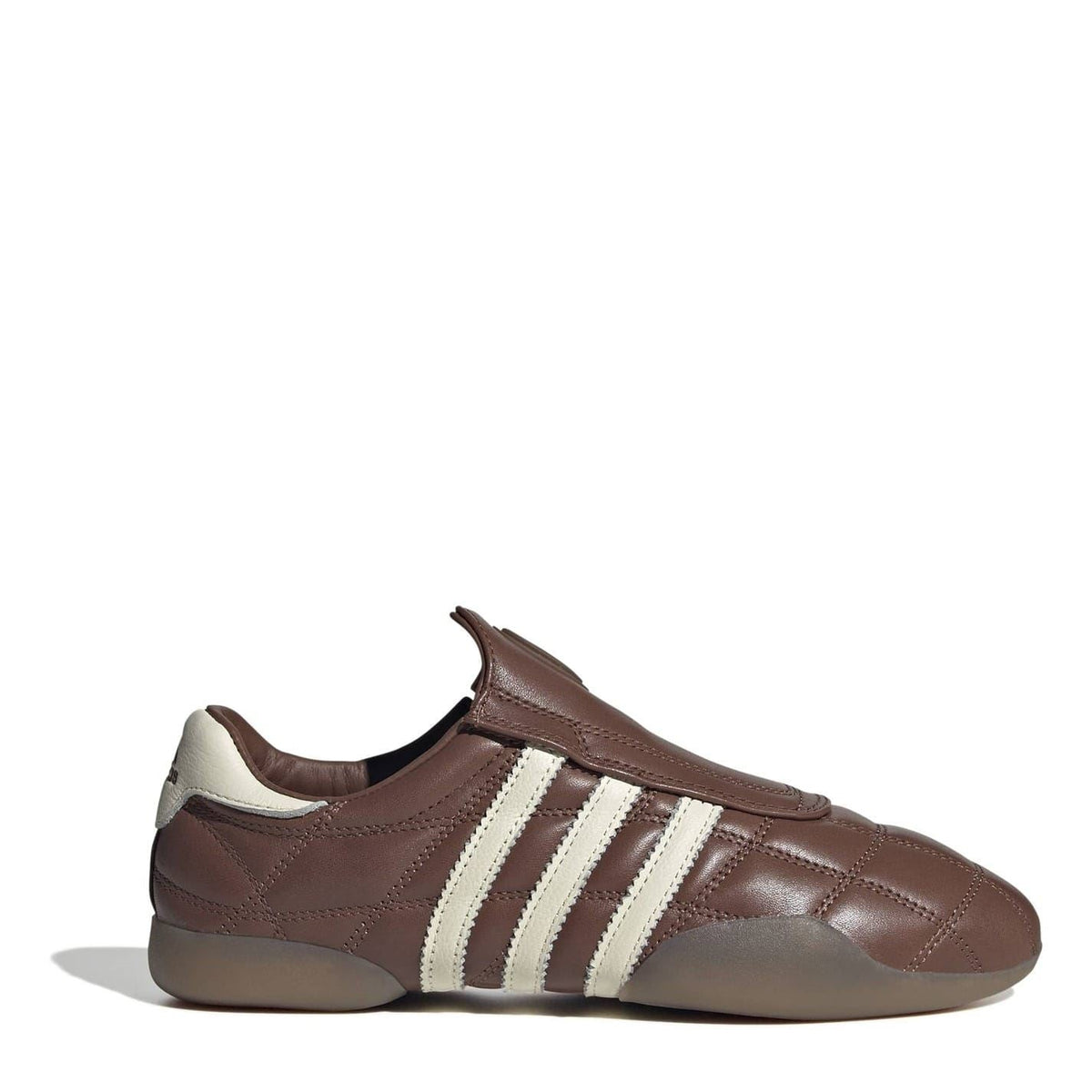 Brown and cream adidas Originals low top sneakers with three side stripes.