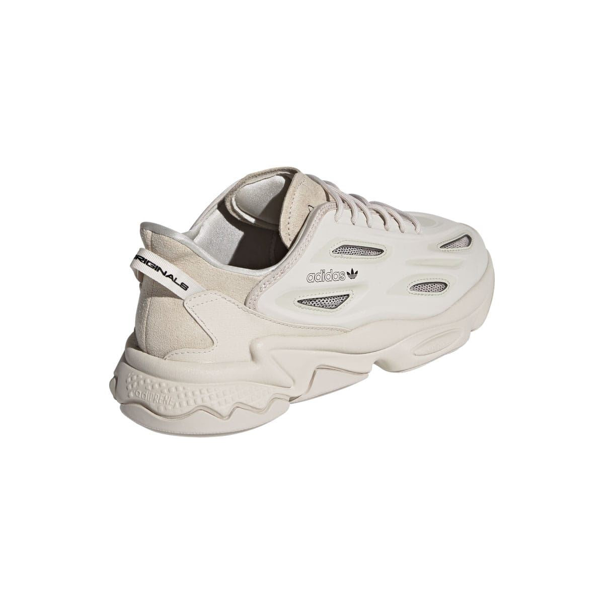 adidas Ozweego trainers back three-quarter view in light cream with heel tab and molded branding