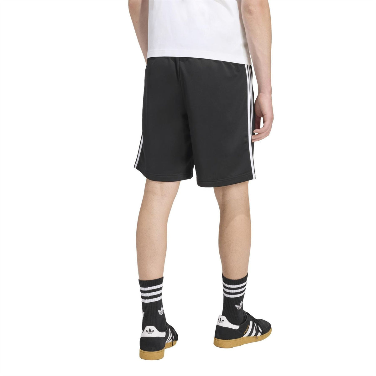 Black track shorts with white side stripes and adidas logo on rear
