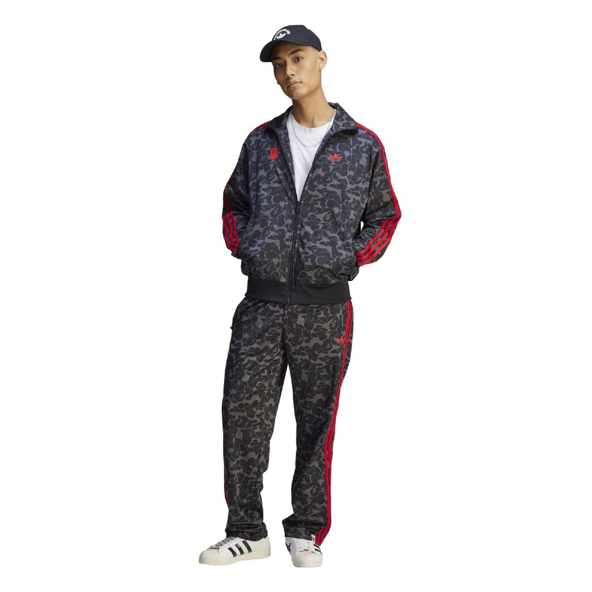 Black camo track jacket with red stripes, full-zip front, and stand collar
