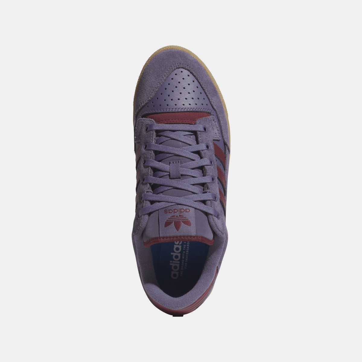 Violet suede adidas Originals low-top shoe front with lace-up and perforated toe