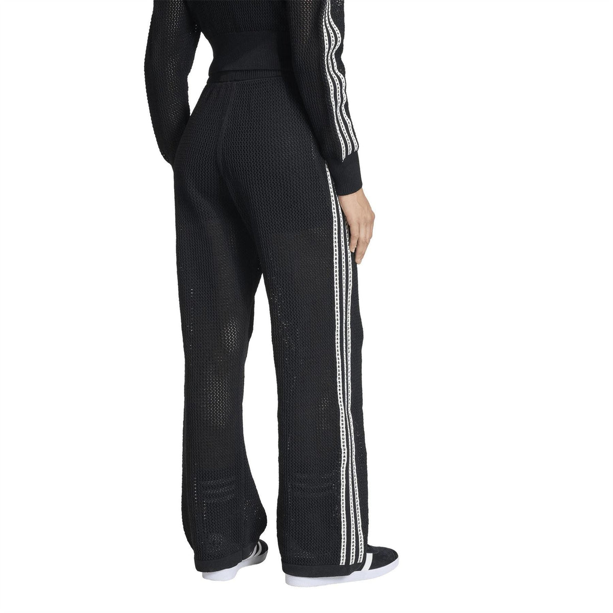 Black women's jersey joggers with side stripe tape, drawstring waist, open hems