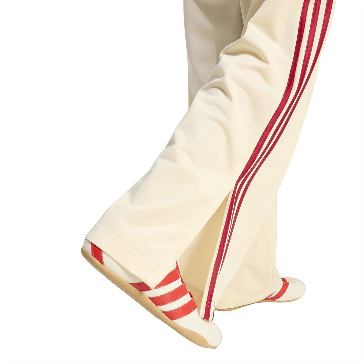 Cream jogger pants with red triple stripe and open hem cuff