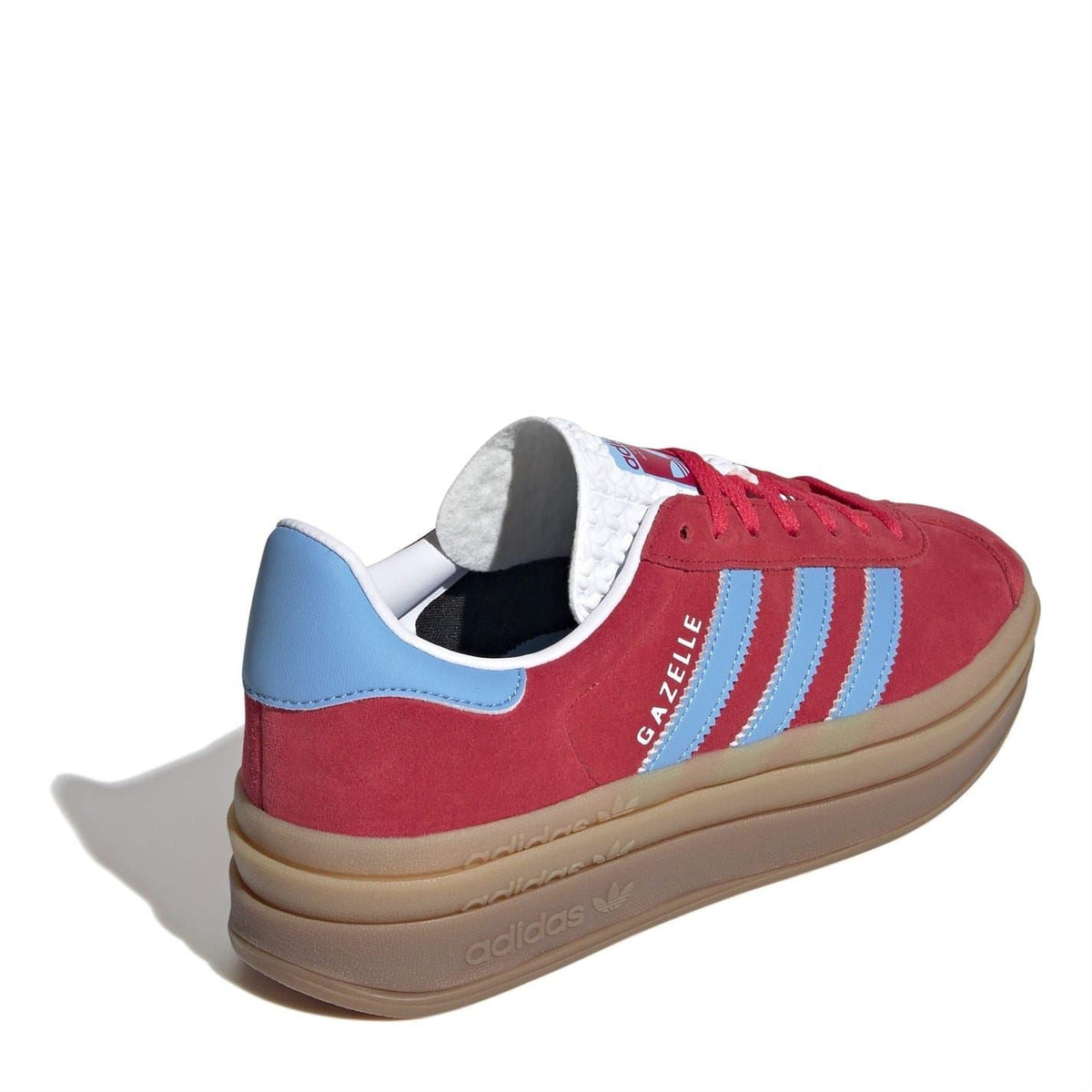 Red Gazelle low-top sneakers with blue collar, tan midsole, and visible heel badge