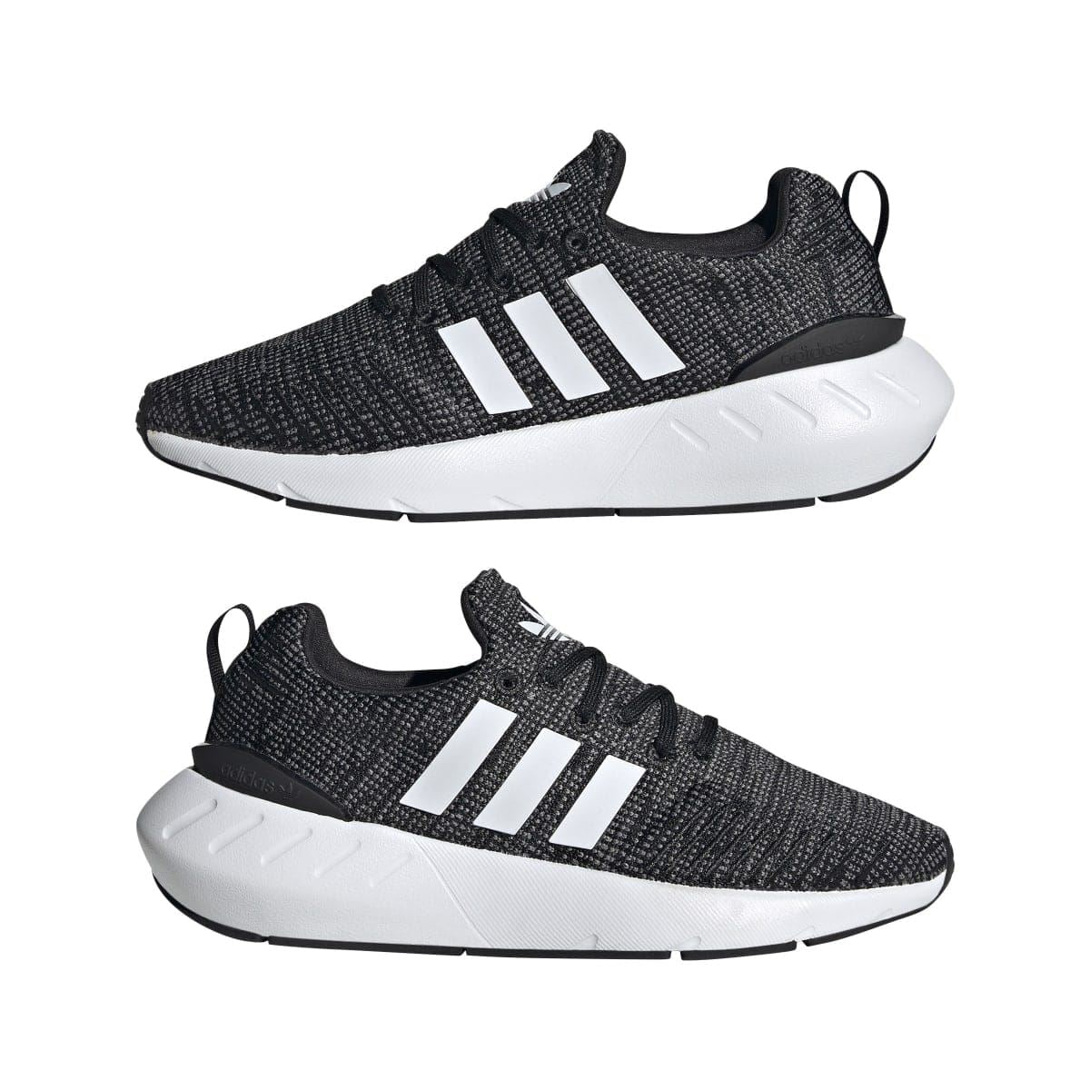 Pair of junior adidas Swift Run 22 trainers, black knit with white stripes and thick white sole.