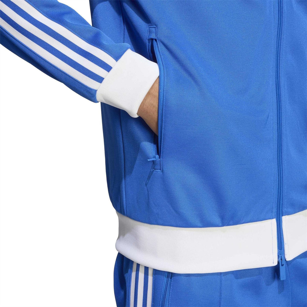 adidas Originals Adicolor Classics track top in vibrant color, featuring sporty design with zip-up front and ribbed cuffs.