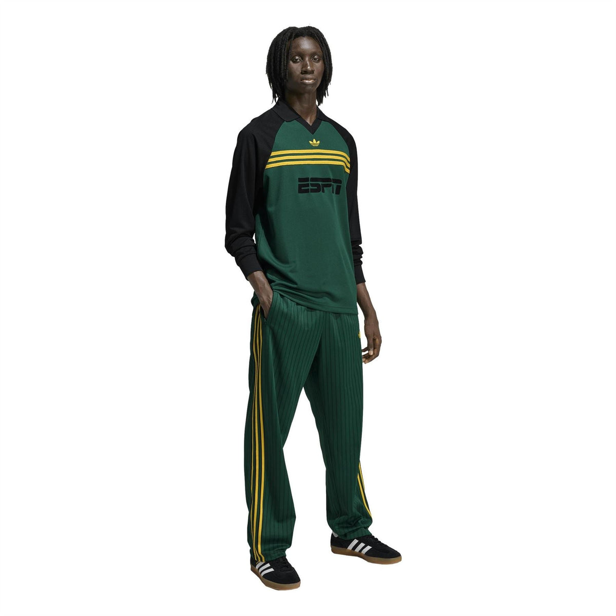 Adidas Originals Firebird track pants with gold emblem, dark green and yellow stripes