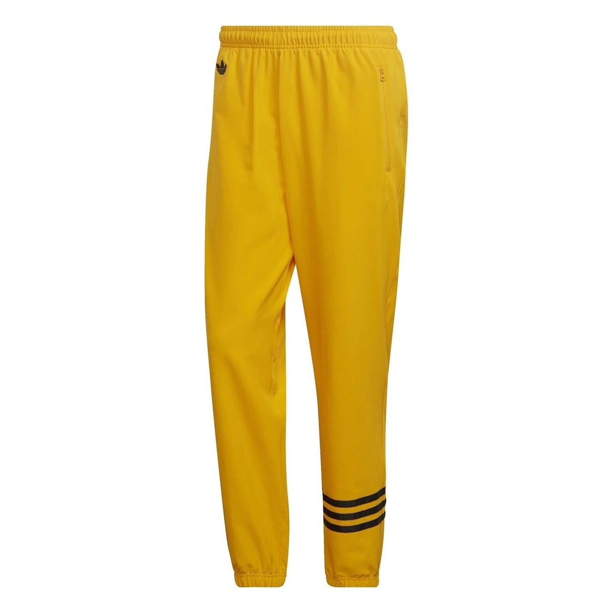 Gold adidas Originals joggers with elastic waistband and tapered cuffs
