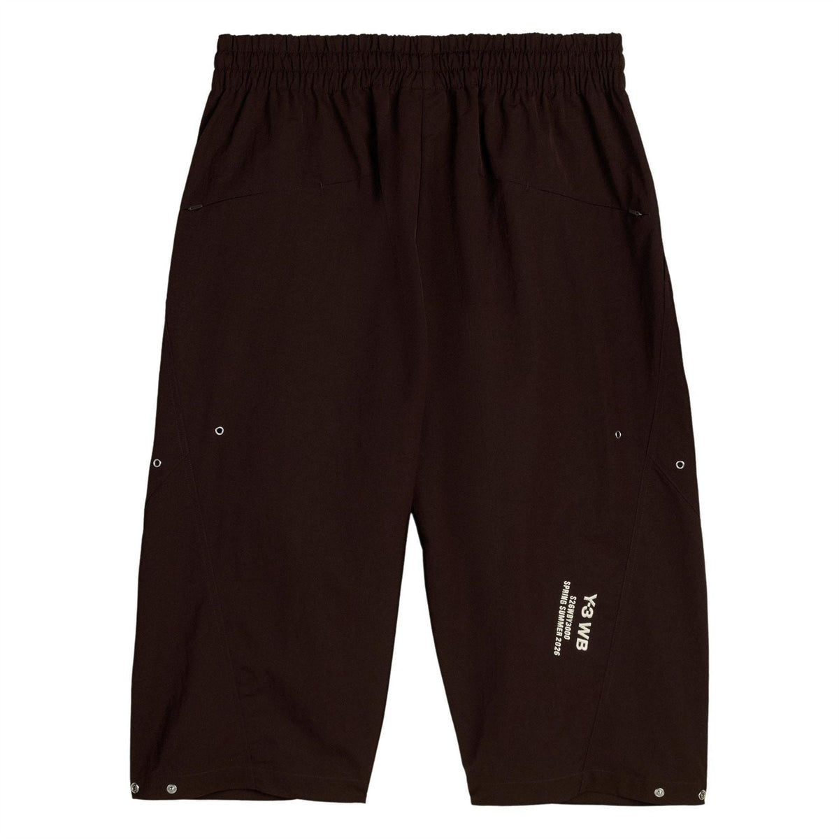 Brown knee-length shorts with elastic waist, front drawstring, and back logo patch