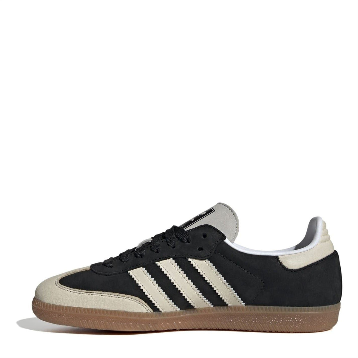 Black suede low-top sneakers with lace-up front, three white stripes, gum sole