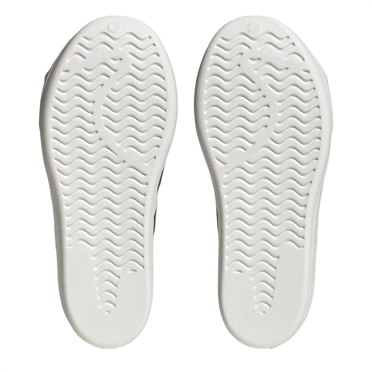 Junior adidas Originals Superstar Slip On Trainers in size 3-5, featuring classic white design with black stripes and comfortable slip-on style.