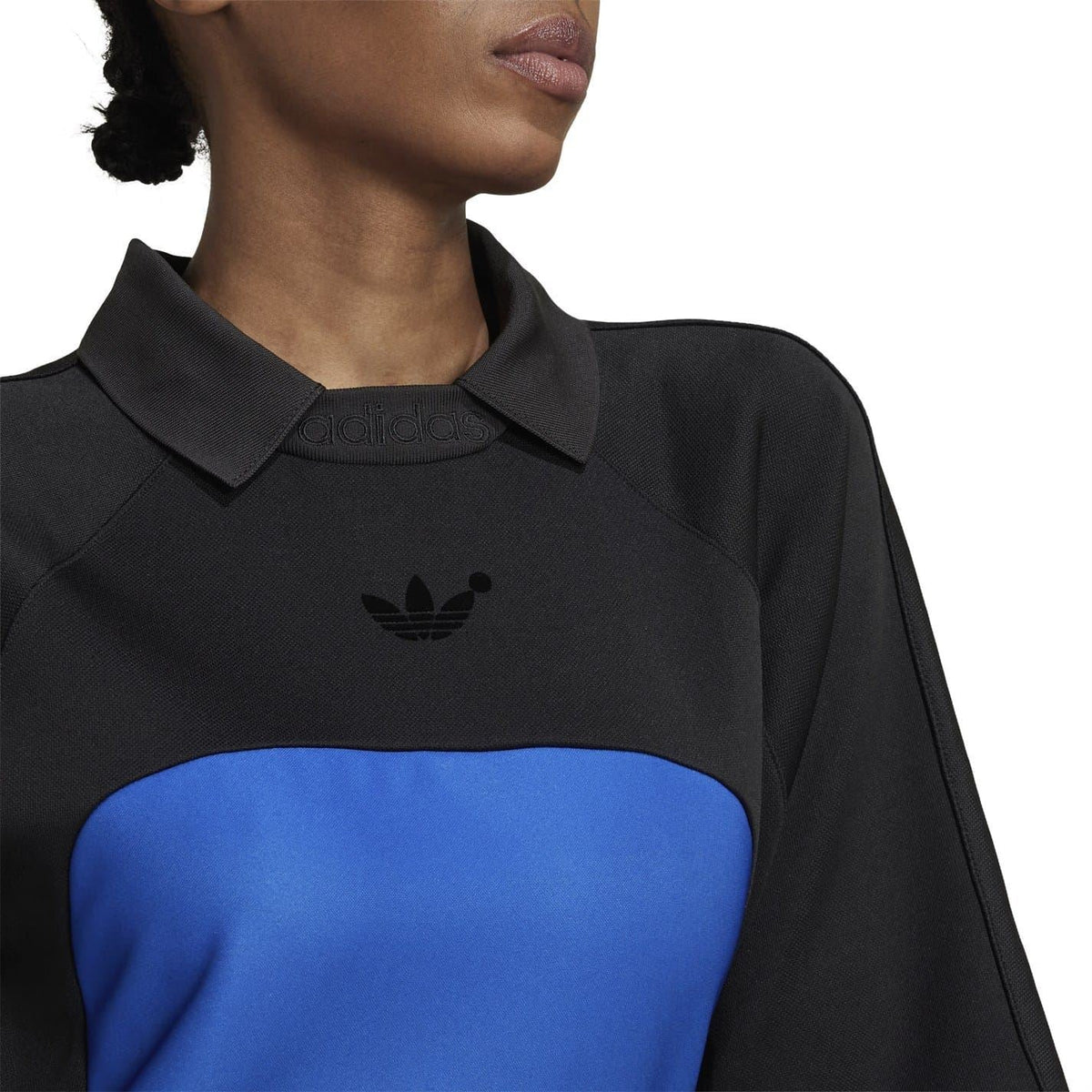 Black polo-style dress with blue chest panel and adidas trefoil logo