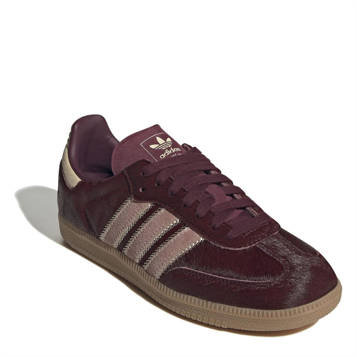 Burgundy adidas Samba OG sneakers with lace-up front, three stripe overlays, gum sole