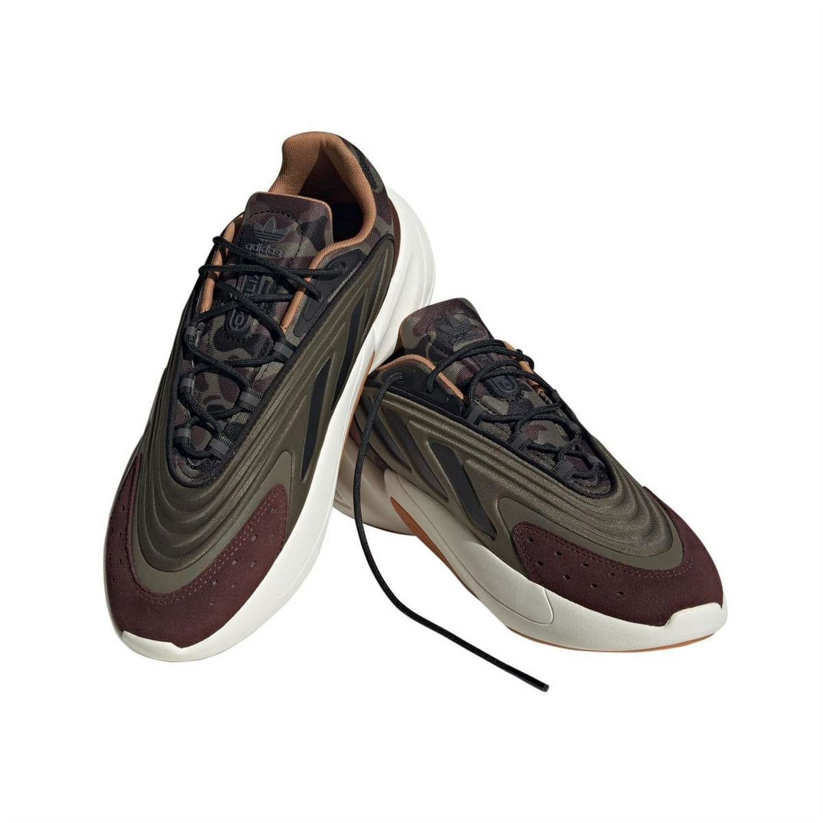 Trainers shown open: lace-up dark upper with olive stripes and white midsole