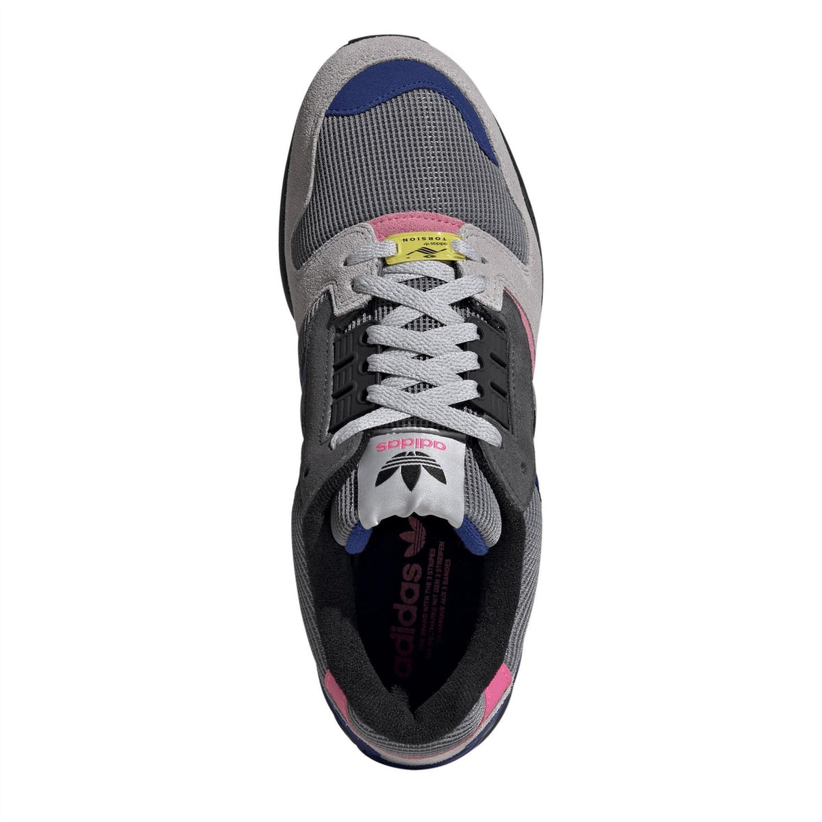 Sneaker opening with grey laces, black lining, and multicolor tongue and heel graphics