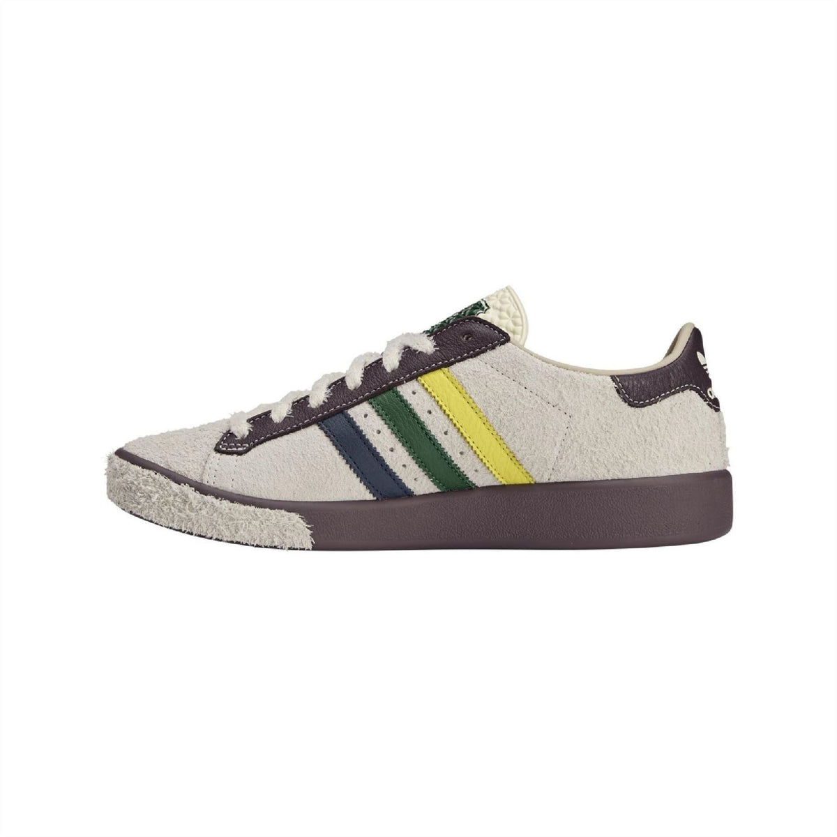 Cream low-top sneakers with navy side stripes, green/yellow accents and brown sole