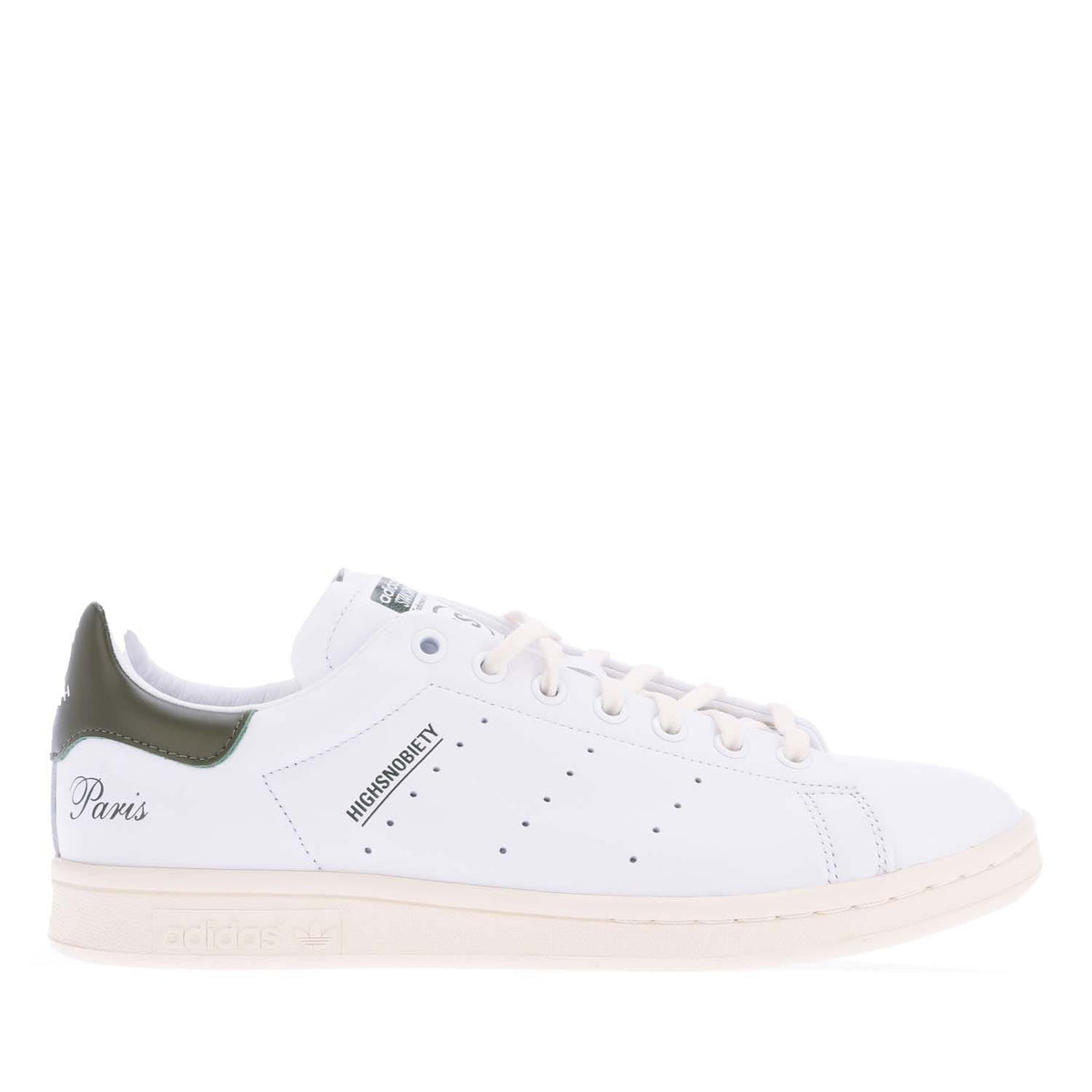 White high-top sneakers with green heel and side accents, lace-up design