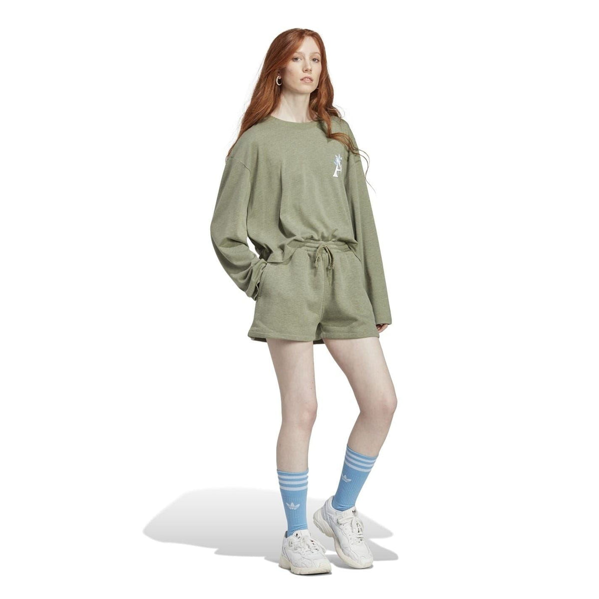 Green drawstring sweat shorts with small Moomin logo on the front hem