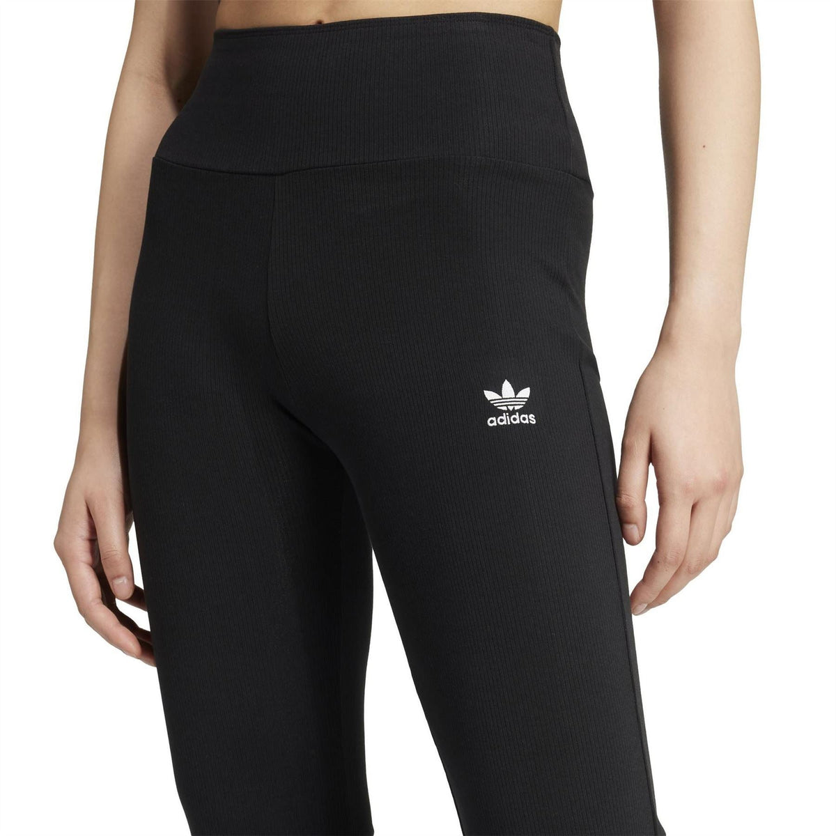Black flared leggings with ribbed texture and trefoil logo on back