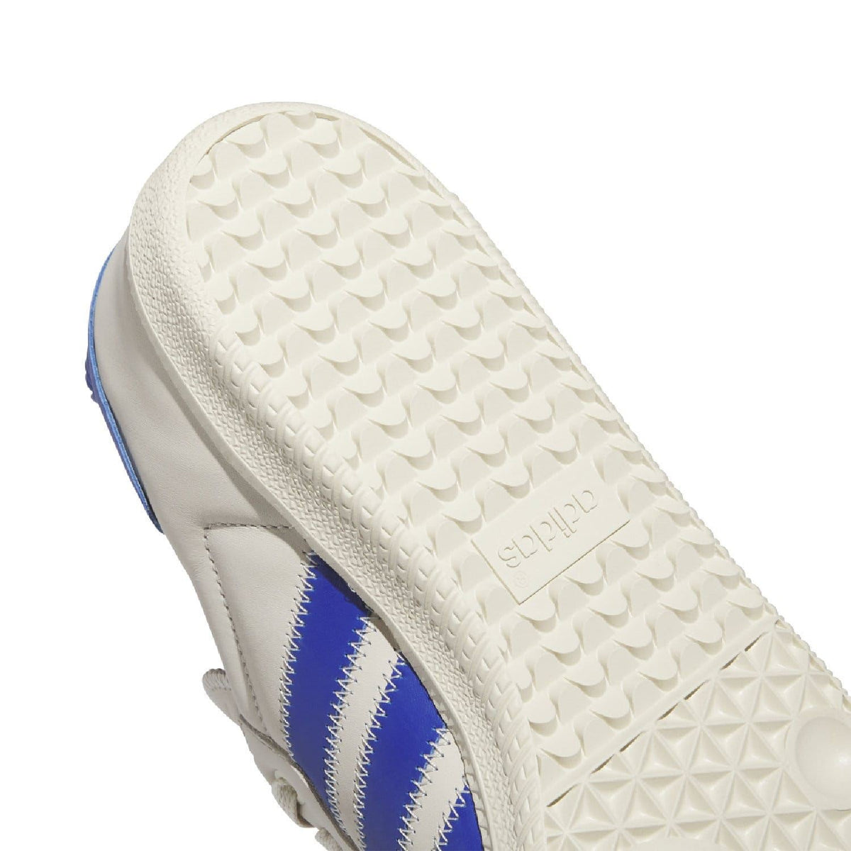 Textured white outsole with adidas branding and blue three-stripe upper detail