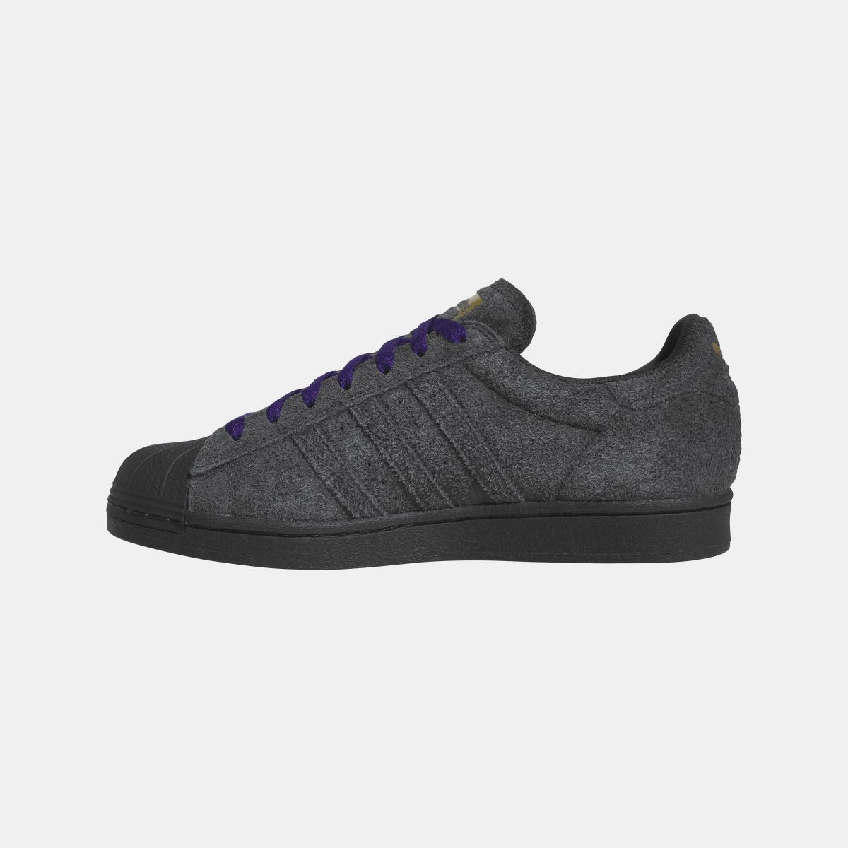 adidas Originals Superstar ADV shoes in white with black stripes, showcasing classic sneakers design and textured rubber soles.