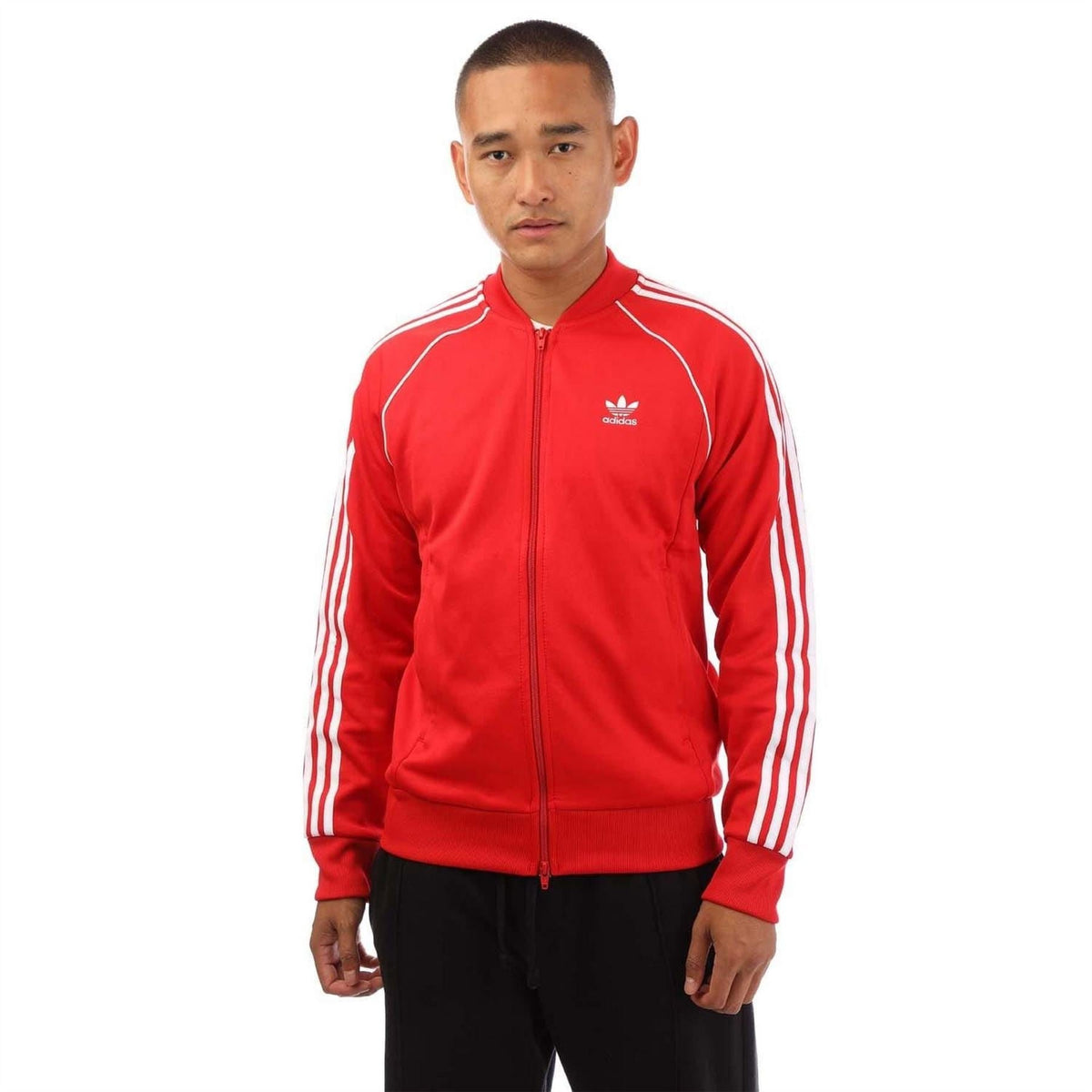 Red adidas Originals track jacket with full zip and white triple side stripes.