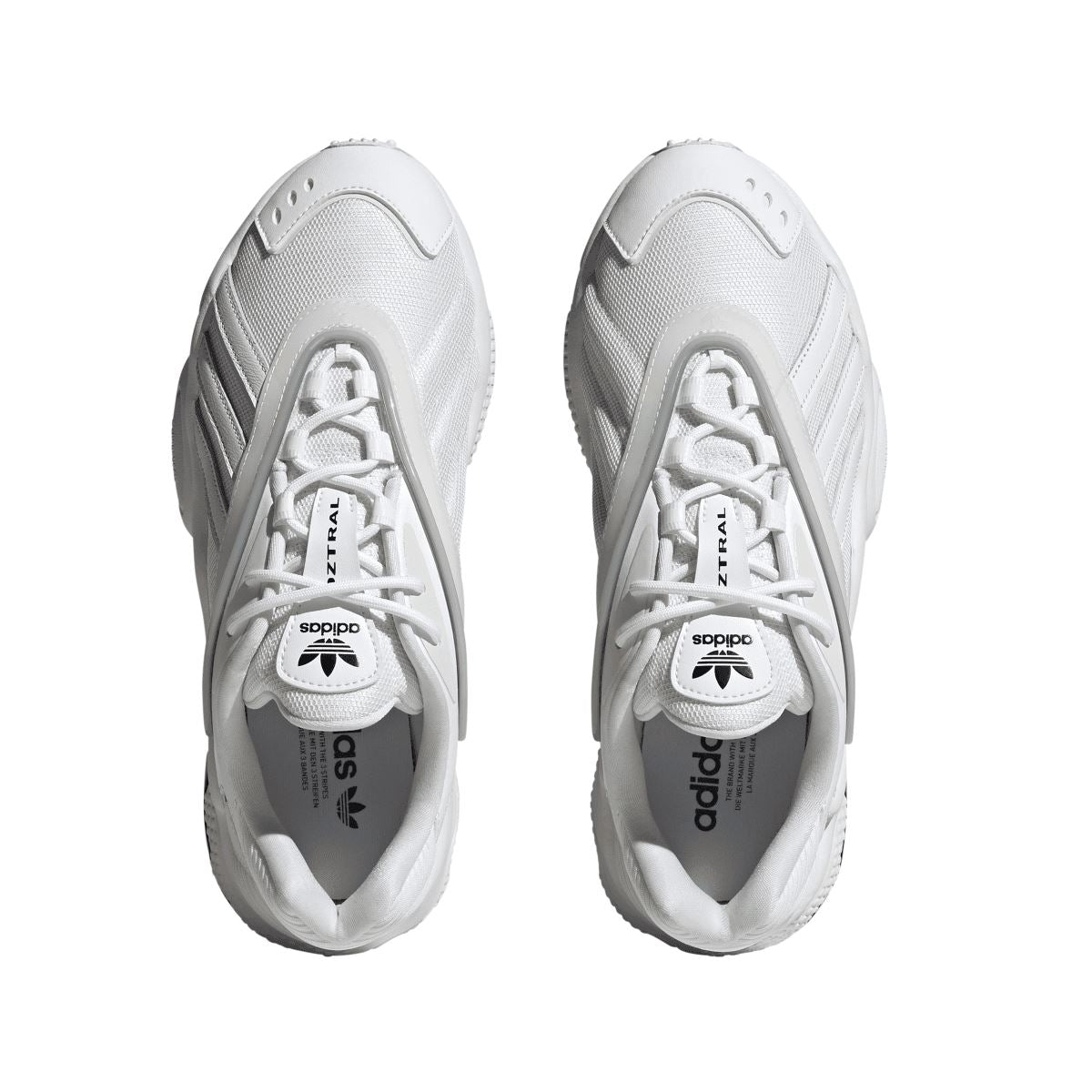 Pair of white adidas Originals Oztral trainers, top view with laces and adidas logo